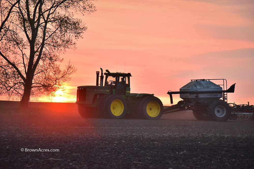 Farmer Sunset John Deere 9200 with Bourgault drill planting Canola